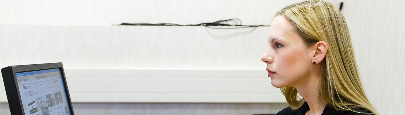 Caroline Jay sitting at a desk using a computer